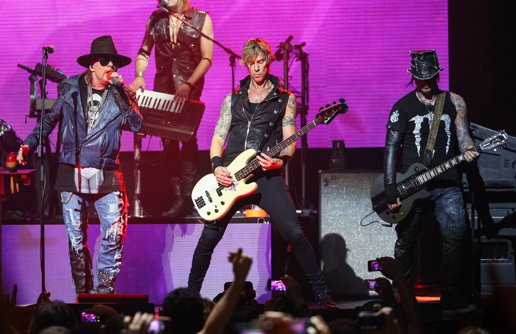 Duff McKagan, center, with (from left) Axl Rose and DJ Ashba, as Guns N’ Roses perform at the Sixth Annual Revolver Golden Gods Award Show in Los Angeles in 2014. (Paul A. Hebert / Invision / AP)