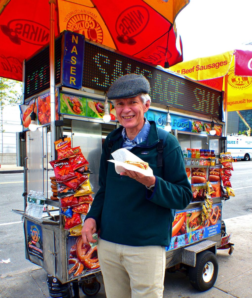 Brian Cantwell samples a $3 New York hot dog from a street cart. (Photo by Barbara A. Cantwell )