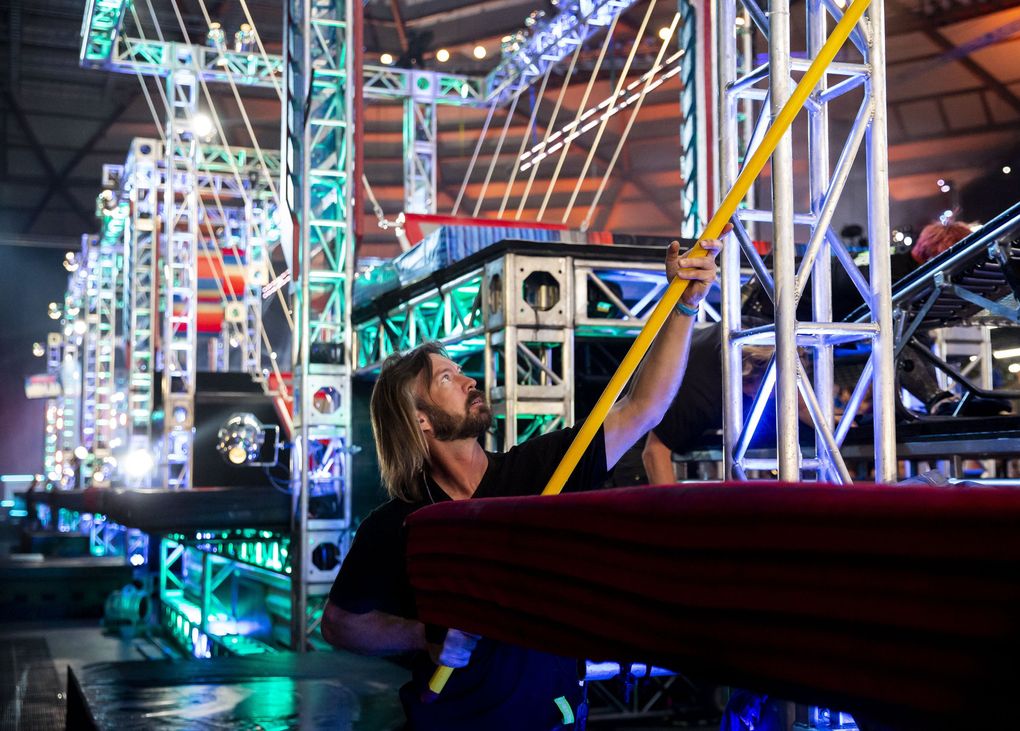 Michael Fowler, a member of the ATS Team, resets an obstacle for the next competitor during the “American Ninja Warrior” taping at the Tacoma Dome. (Erika Schultz / The Seattle Times)