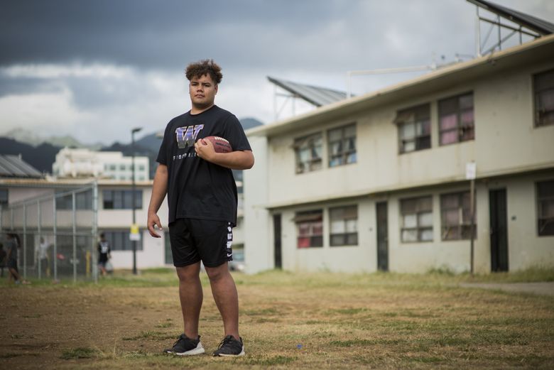 Faatui Tuitele, St Louis High School football player and top recruit in University of Washington’s 2019 class, at the Mayor Wright Housing where he grew up.  (Elyse Butler / Special to The Seattle Times) 