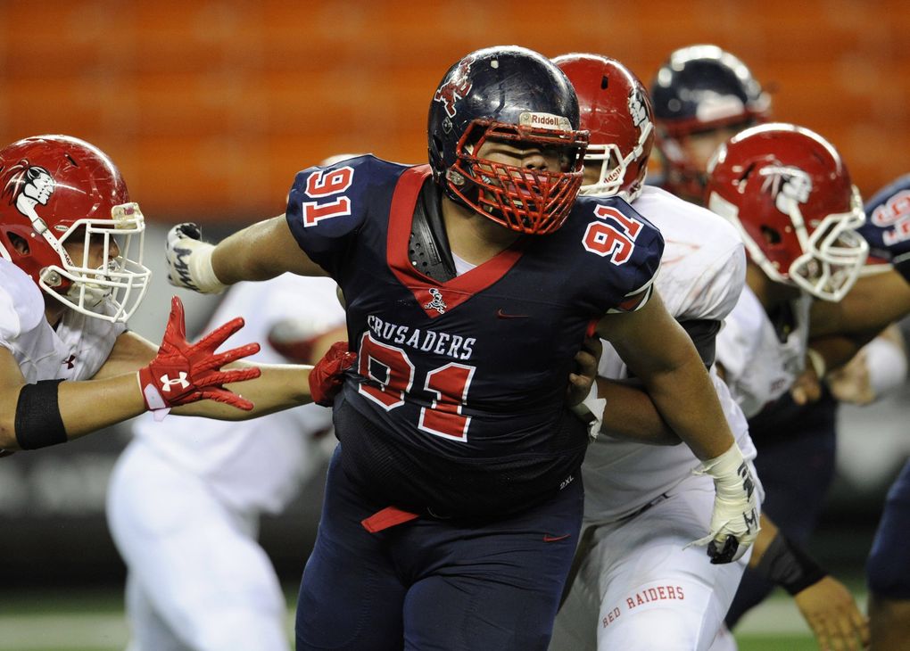 Saint Louis defensive lineman Faatui Tuitele (91) turns to follow the football in the third quarter of the Kahuku vs Saint Louis Open Division football game at Aloha Stadium, Friday, September 7, 2018. (Bruce Asato / Honolulu Star Advertiser)