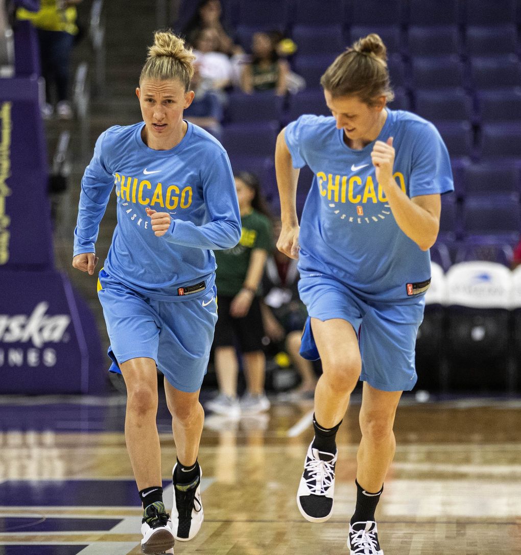 Courtney Vandersloot, left, and Allie Quigley are spouses and teammates on the Chicago Sky. (Dean Rutz / The Seattle Times)