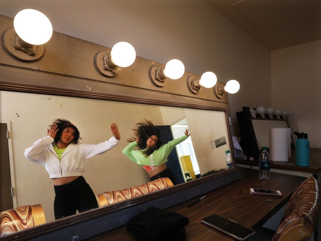 Corynn Smith and Miku Hanatate, with EmeRain, rehearse in the dressing room of the Broadway Performance Hall at Seattle Central College before the K-Pop auditions Friday. (Alan Berner / The Seattle Times)