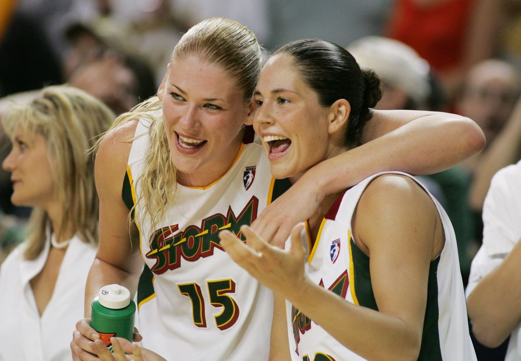Lauren Jackson and Sue Bird enjoy the last seconds of their victory over Minnesota as the Storm takes another step toward the playoffs in 2005.
(Jim Bates / The Seattle Times)