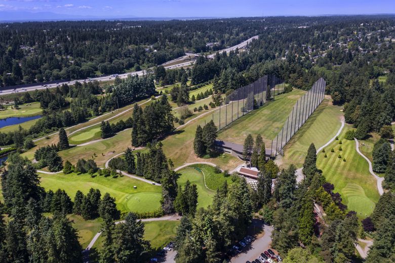 Seattle is considering what to do with the 4 city-owned golf courses, including this one — Jackson Park  in north Seattle. Interstate 5 is just above the course. (Steve Ringman / The Seattle Times)