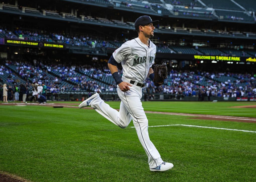 Braden Bishop runs onto the field in April. (Dean Rutz / The Seattle Times)