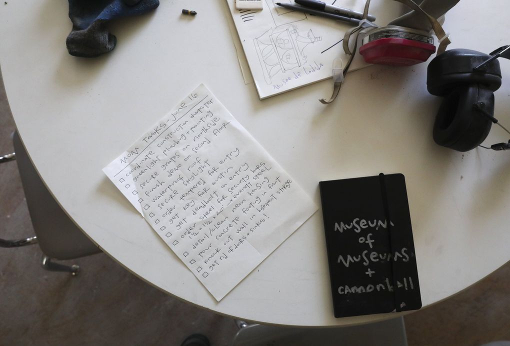 Greg Lundgren has his to-do list and other things on a work table to assist him in creating Museum of Museums. (Ken Lambert / The Seattle Times)