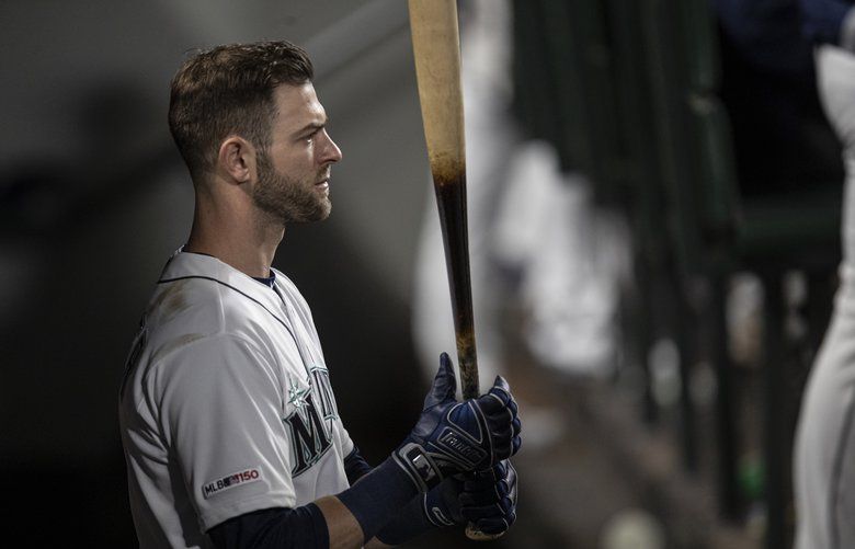 Seattle Mariners’ Mitch Haniger stands in the dugout with bat in hand during a baseball game against the Minnesota Twins, Thursday, May 16, 2019, in Seattle. The Twins won 11-6. (AP Photo/Stephen Brashear) OTK31 OTK31