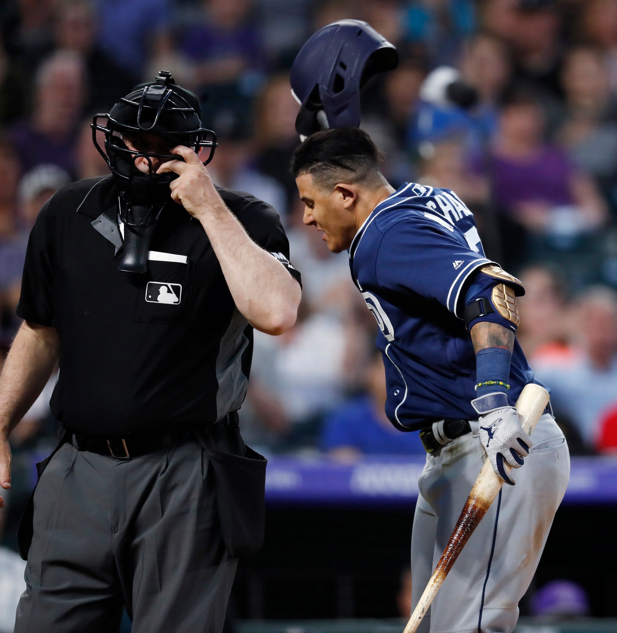 San Diego Padres' Manny Machado screams at Fernando Tatis Jr. in