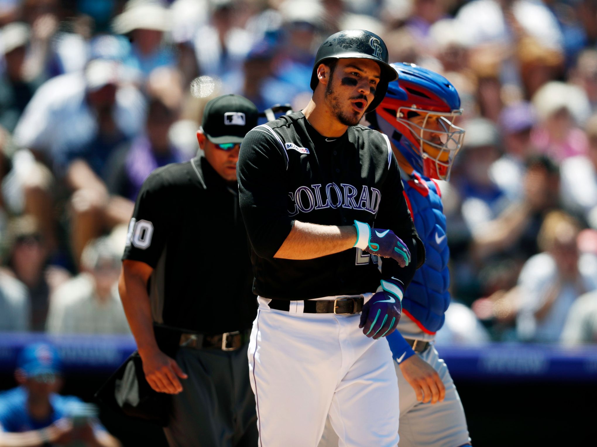 Rockies' Nolan Arenado charges mound after Padres pitcher throws