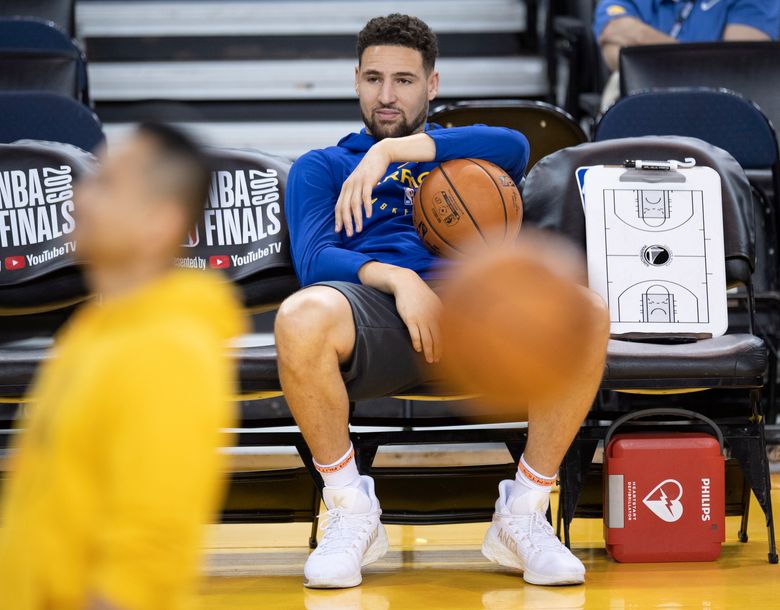 Golden State Warriors’ Klay Thompson sits on the bench watching teammates during practice for the NBA Finals against the Toronto Raptors Tuesday, June 4, 2019, in Oakland, Calif. Game 3 of the NBA Finals is Wednesday, June 5, 2019, in Oakland, Calif. (Frank Gunn/The Canadian Press via AP)