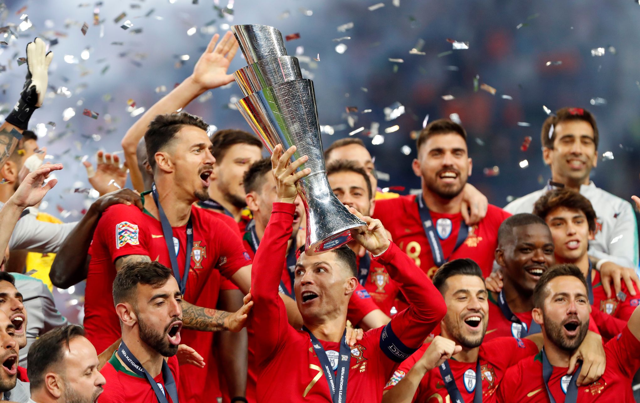 Porto players celebrate as they lift the trophy after beating