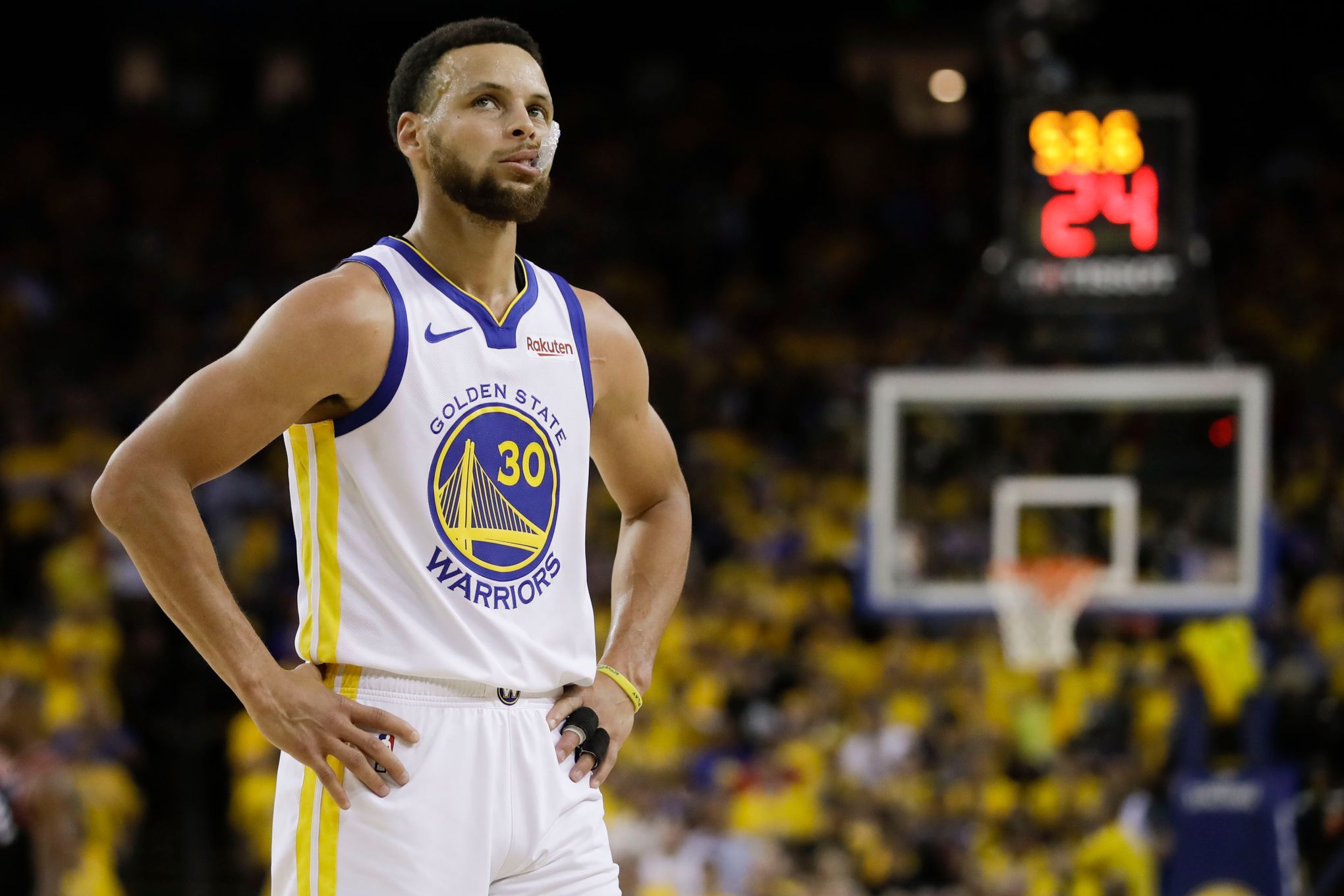 Golden State Warriors' Stephen Curry looks up from the floor in the first  quarter during game 3 of the NBA Finals between the Golden State Warriors  and the Toronto Raptors at Oracle