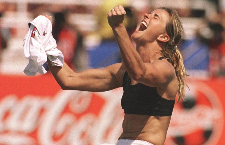 The United States’ Brandi Chastain celebrates after kicking the game-winning overtime penalty shootout goal against China during the Women’s World Cup Final at the Rose Bowl in Pasadena, Calif., Saturday, July 10, 1999. The U.S. beat China 5-4 on penalty kicks after a 0-0 tie.  (AP Photo/The San Francisco Examiner, Lacy Atkins) MANDATORY CREDIT