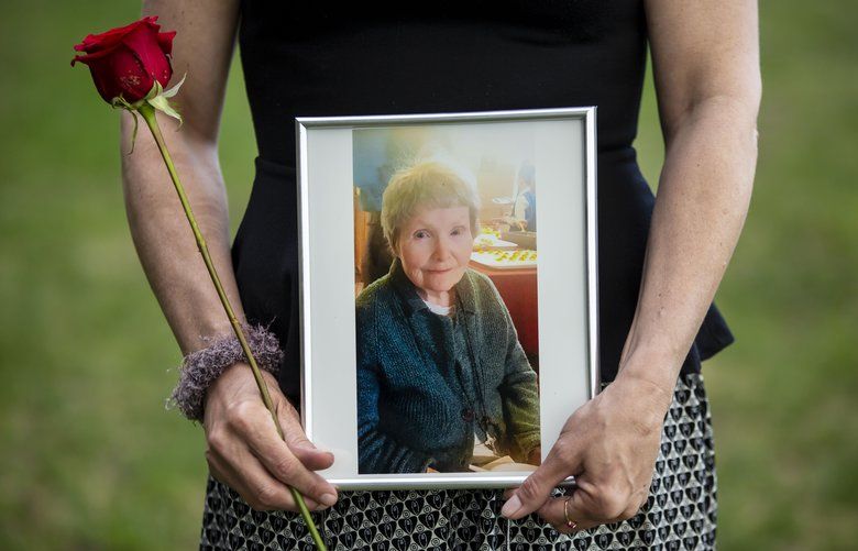 Marjorie Erickson holds a photograph of her mother Rosemary Torgesen in Shoreline, Washington Thursday, April 4, 2019. “She was a strong, strong woman,” she says. 209811