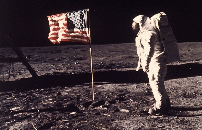 FILE – In this image provided by NASA, astronaut Buzz Aldrin poses for a photograph beside the U.S. flag deployed on the moon during the Apollo 11 mission on July 20, 1969. Television is marking the 50th anniversary of the July 20, 1969, moon landing with a variety of specials about NASA’s Apollo 11 mission. (Neil A. Armstrong/NASA via AP, File) NYET503 NYET503