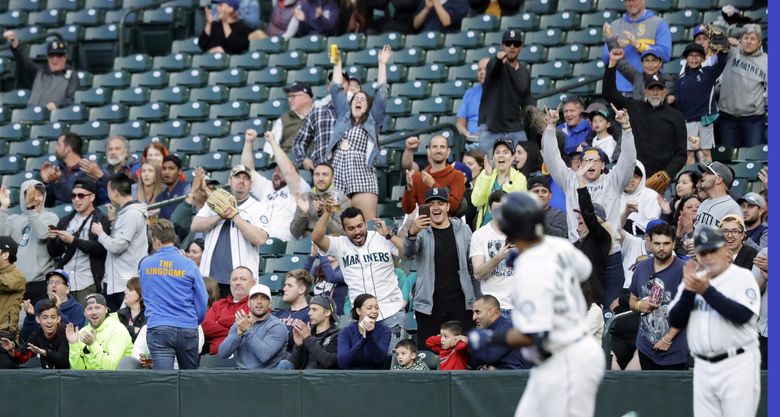 Mariners fans cheer for a home run against the Houston Astros in 2019. (AP Photo / Ted S. Warren)