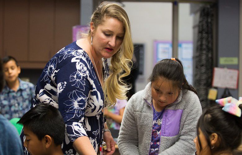 Paraeducator Tiffany Moritz assists Nataly Cruz, 9, with her end of the year animal research project in Ms. Olivera’s classroom on Friday, June 7, 2019, at Martin Luther King Elementary, 2000 S. 18th St. in Union Gap, Wash. 210469 (Amanda Ray, Yakima Herald-Republic)