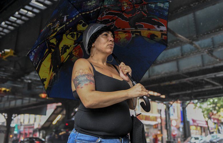 Raquel Morales in the Bronx, July 18, 2019. Temperatures in the city are forecasted to reach 100 degrees over the weekend. (Desiree Rios/The New York Times) XNYT234 XNYT234