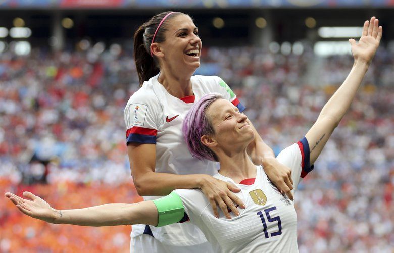 United States’ Megan Rapinoe, right, celebrates after scoring the opening goal from the penalty spot during the Women’s World Cup final soccer match between US and The Netherlands at the Stade de Lyon in Decines, outside Lyon, France, Sunday, July 7, 2019. (AP Photo/Francisco Seco) XAF174 XAF174