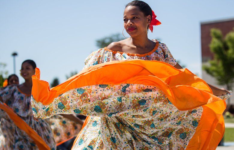 Yvette McDonald of PanamÃ¡ Folklore: Bailes y AlegrÃ­as dances with the rest of the group at the Caribbean Sea Fest in Jimi Hendrix Park on Sunday, July 28. The event aims to bring together the culturally and linguistically diverse members of the Caribbean Community in the Pacific Northwest, and to invite those interested to share in a day of cultural exchange. 211019