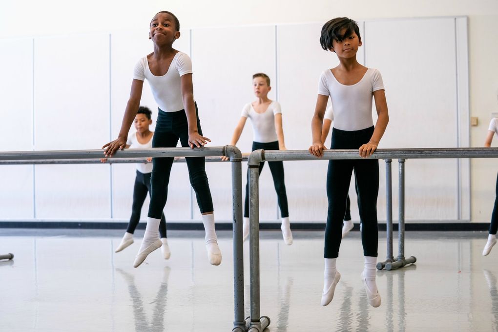 DanceChance students Joe Jr. (L.J.) Vinson, left back barre; Adam Abdi, front barre; Weston Baldwin, back barre; and Liam Navarro, front barre, at Pacific Northwest Ballet School. (Joseph Lambert)