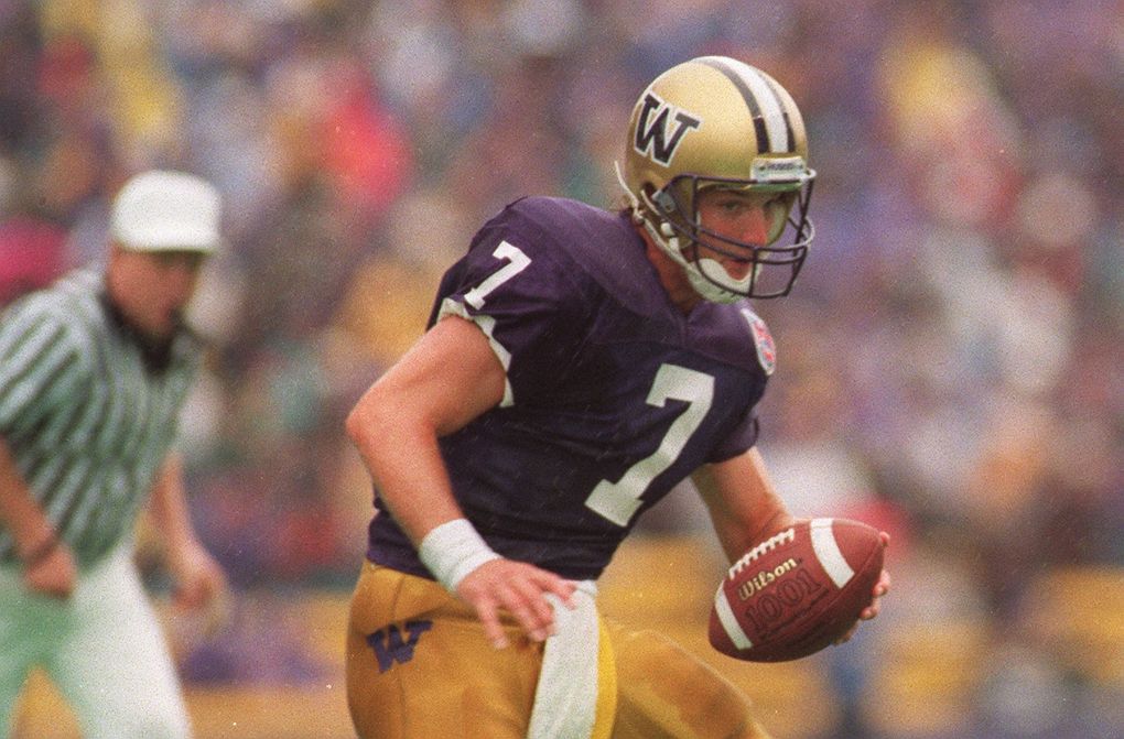 Damon Huard hands the ball off in 1994. (Rod Mar / The Seattle Times)