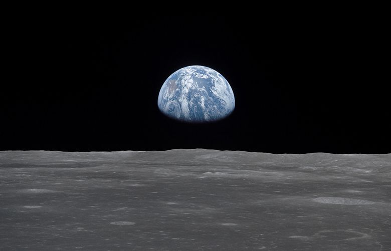 (July 1969) — This view from the Apollo 11 spacecraft shows the Earth rising above the moon’s horizon. The lunar terrain pictured is in the area of Smyth’s Sea on the nearside. Coordinates of the center of the terrain are 85 degrees east longitude and 3 degrees north latitude. While astronauts Neil A. Armstrong, commander, and Edwin E. Aldrin Jr., lunar module pilot, descended in the Lunar Module (LM) “Eagle” to explore the Sea of Tranquility region of the moon, astronaut Michael Collins, command module pilot, remained with the Command and Service Modules (CSM) “Columbia” in lunar orbit. View of Moon limb with Earth on the horizon,Mare Smythii Region. Earth rise. This image was taken before separation of the LM and the Command Module during Apollo 11 Mission.