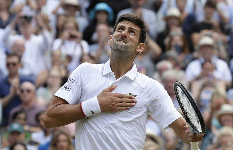 Serbia’s Novak Djokovic celebrates defeating Switzerland’s Roger Federer in the men’s singles final match of the Wimbledon Tennis Championships in London, Sunday, July 14, 2019. (AP Photo/Kirsty Wigglesworth) XVG266 XVG266