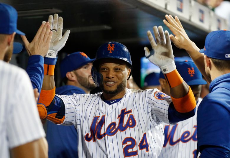 Robinson Cano of the New York Yankees is congratulated by