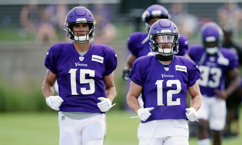 Minnesota Vikings wide receivers Brandon Zylstra, left, and Chad Beebe run  during calisthenics at the NFL football team's training camp Monday, July  29, 2019, in Eagan, Minn. (AP Photo/Jim Mone Stock Photo 