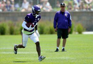 Minnesota Vikings wide receivers Brandon Zylstra, left, and Chad Beebe run  during calisthenics at the NFL football team's training camp Monday, July  29, 2019, in Eagan, Minn. (AP Photo/Jim Mone Stock Photo 