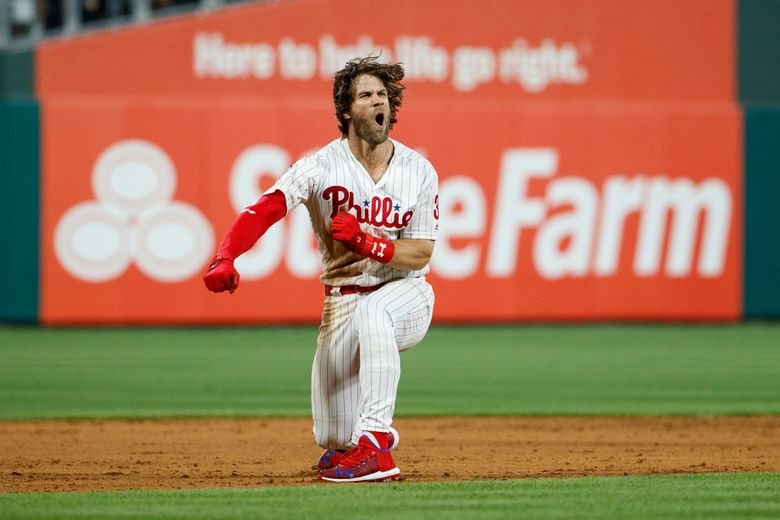 Phillies score five in ninth to rally by Nationals