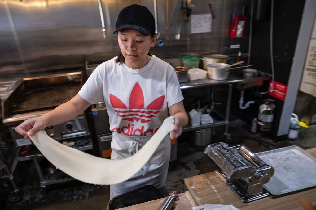 Na Lu, who runs Northern Dumpling House with her husband, makes dumplings and noodles from scratch. (Dean Rutz / The Seattle Times)