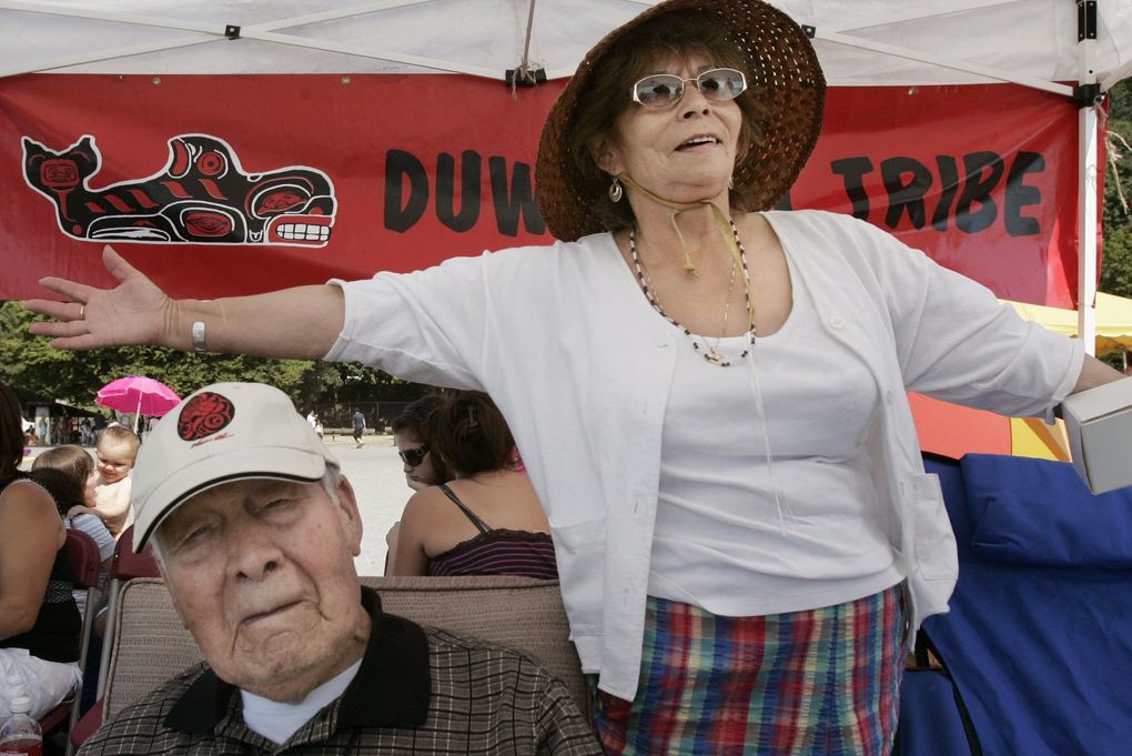 On Aug. 2, 2011: Emmett Oliver, left, and Cecile Hansen, chairwoman of the Duwamish tribe, awaite the arrival of canoes at Golden Gardens. Oliver had come up with the idea that became the “Paddle to Seattle” for the state’s 1989 centennial celebration. (Alan Berner / The Seattle Times, 2011)