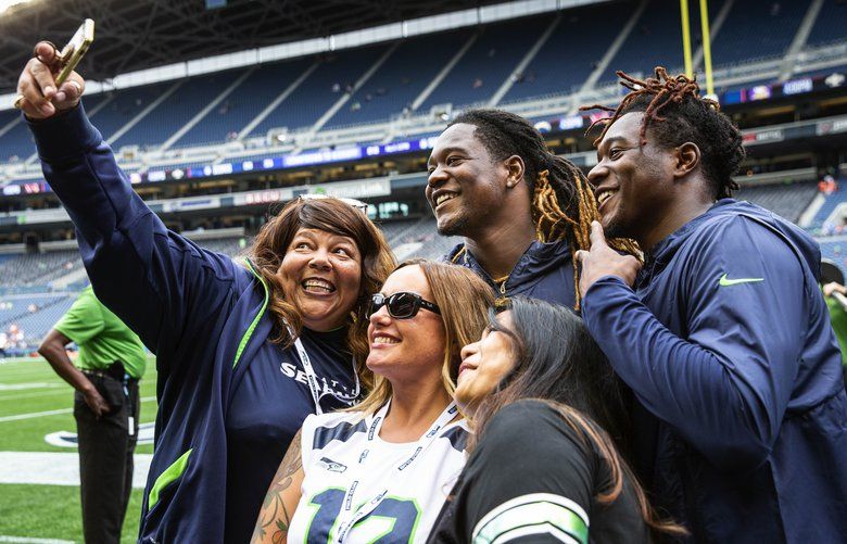 Brothers Shaquill (left) and Shaquem Griffin do a selfie with fans on the Seahawks sidelines before Thursday’s preseason game with Denver.  

The Denver Broncos played the Seattle Seahawks preseason NFL Football Thursday, August 8, 2019 at CenturyLink Field in Seattle, WA. 211084