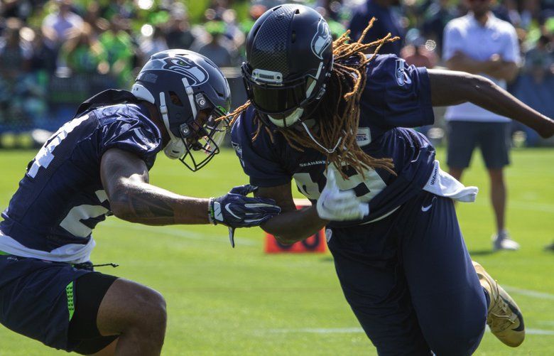 Seahawks’ Shalom Luani, SS, #24 (l) and Shaquem Griffin, LB, #49 go through  drills at the  twelfth and final training camp practice at the VMAC in Renton Thursday, August 15, 2019.   210914