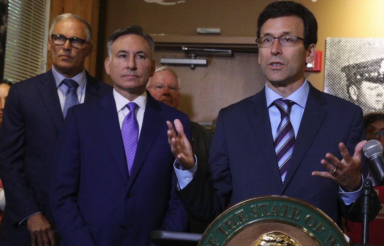 From left: Gov. Jay Inslee (WA-D); King County Executive Dow Constantine; and Attorney General Bob Ferguson, at a Title X press conference shortly after Inslee announced he will run for a third term as governor, having dropped his presidential bid, Thursday, Aug. 22, 2019 in Seattle. 211263