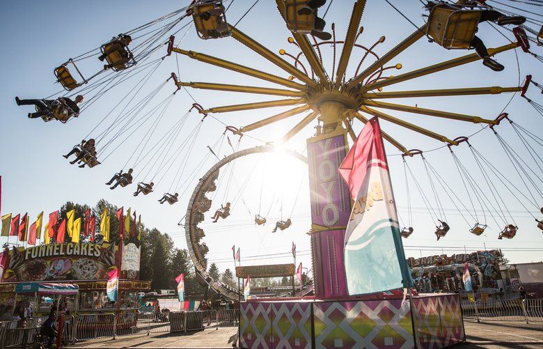 Fair goers ride the Yoyo at the Evergreen State Fair in Monroe on Monday, August 26. The fair continues through September 2. 211262