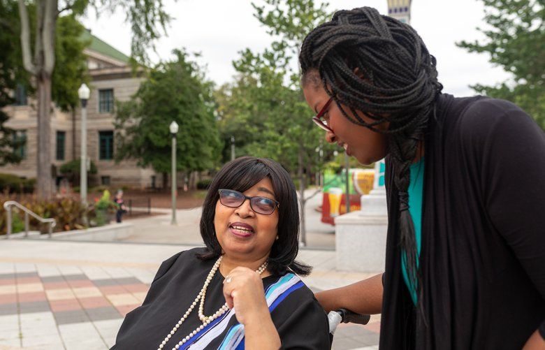 Aisha Adkins with her mother, Rose, whose dementia was diagnosed six years ago, in Decatur, Ga., on Aug. 25, 2019. The elder Adkins can’t be left alone. The needs of older relatives remove women from the labor force in the United States far more than in other wealthy nations, at a cost to the economy. (Lynsey Weatherspoon/The New York Times) XNYT65 XNYT65