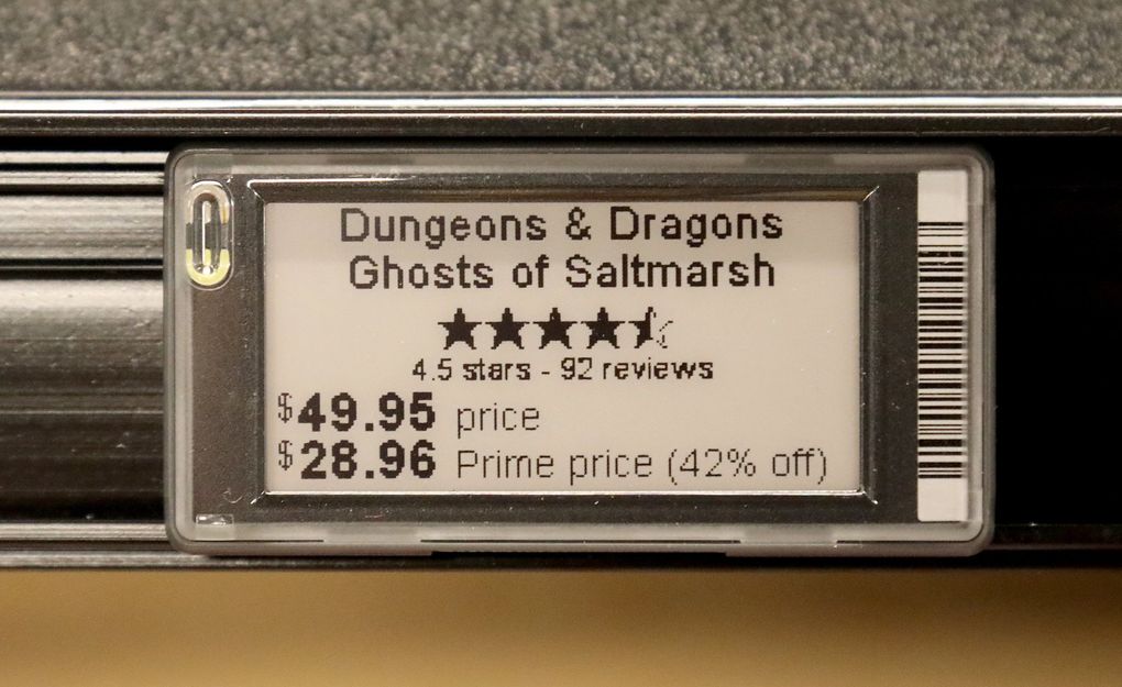 The store’s digital price tags list the regular price along with Prime member deal. The tag updates as Amazon algorithms adjust pricing as many as five times a day. (Greg Gilbert / The Seattle Times)