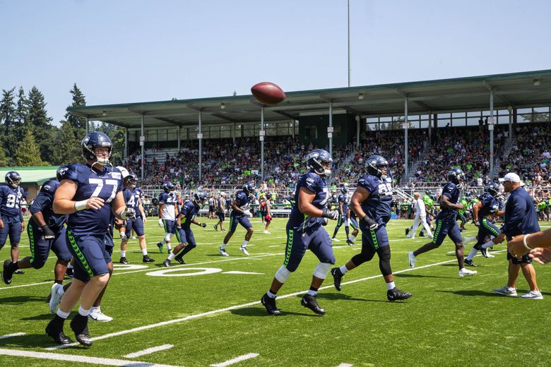 Seattle Seahawks' Jacob Hollister gets ready to toss a ball back at an NFL  football training camp Thursday, Aug. 1, 2019, in Renton, Wash. (AP  Photo/Elaine Thompson Stock Photo - Alamy