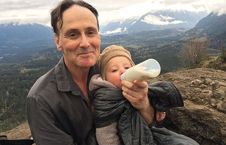 David Guterson,takes a lunch break during a hike with his grandson (granddaughter?). Need final caption from Bill.