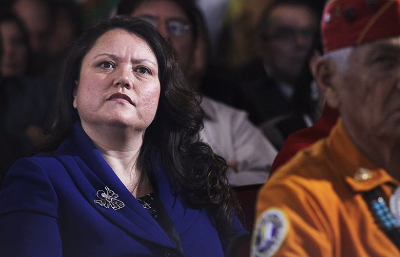 Fawn Sharp, president of the Quinault Indian Nation, left, listens to President Barack Obama speak at the White House Tribal Nations Conference, Thursday, Dec. 16, 2010, at the Interior Department in Washington. (AP Photo/Pablo Martinez Monsivais) DCPM110