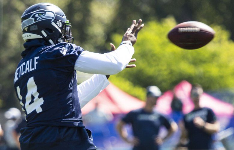 DK Metcalf of the Seattle Seahawks stretches during pregame warmups News  Photo - Getty Images