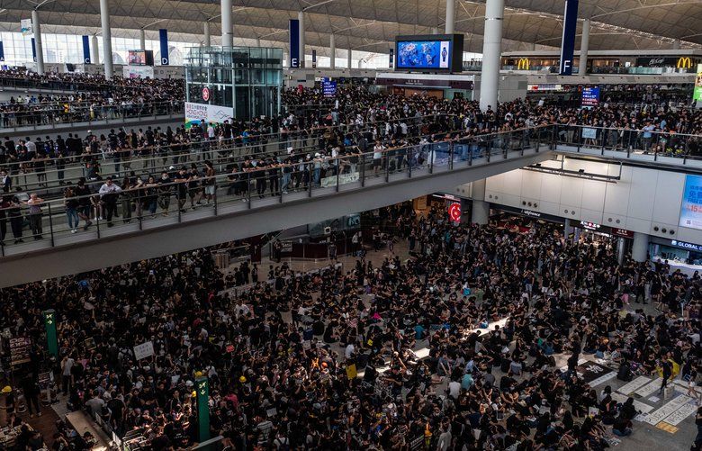 Thousands of protesters fill the arrivals and departures halls at Hong Kong International Airport on Monday, Aug. 12, 2019. The airport came to a near halt on Monday, with more than 150 flights canceled after thousands of demonstrators flooded one of the world’s busiest transportation hubs in a show of anger over the police’s response to protests the night before. (Lam Yik Fei/The New York Times) XNYT2 XNYT2