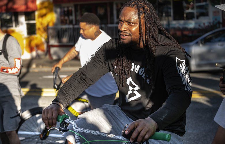 Former Seahawk Marshawn Lynch led a group of BMX riders on a fun ride of downtown Seattle Wednesday.  In collaboration with bike maker SEBikes, Lynch and more than 100 cyclists participated on a “Rideout” from the Space Needle.  Lynch partnered with SEBikes to build the “Beast Mode Ripper” model.  Photographed Wednesday, August 28, 2019. 211348