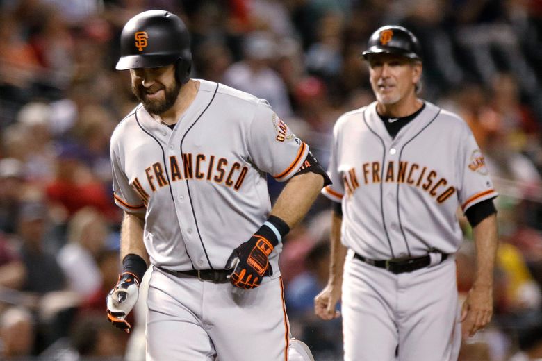 San Francisco Giants third baseman Evan Longoria catches a line