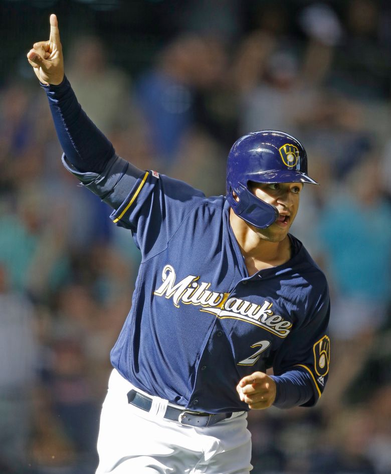 Milwaukee Brewers' Eric Thames stands in the dugout in the fourth