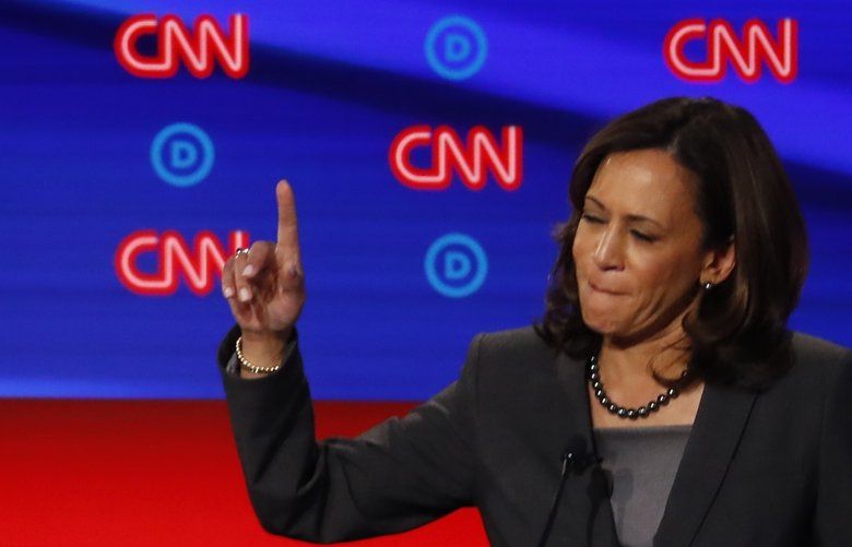 FILE – In this July 31, 2019 photo, Sen. Kamala Harris, D-Calif., and former Vice President Joe Biden participate in the second of two Democratic presidential primary debates hosted by CNN in the Fox Theatre in Detroit. (AP Photo/Paul Sancya) WX102 WX102